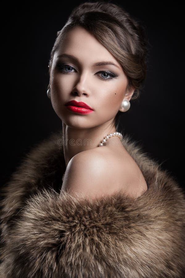 Retro. Beautiful, attractive woman wearing fur