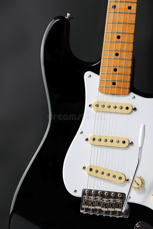 Vintage Black and White Electric Guitar Isolated on White with Clipping