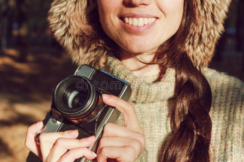 Retro camera in hand of young photographer girl and ready to take photo. royalty free stock photos Retro camera in hand of young photographer girl and ready to take photo. royalty free stock photos