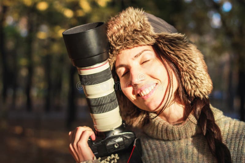 Retro camera in hand of young photographer girl and ready to take photo. royalty free stock photography Retro camera in hand of young photographer girl and ready to take photo. royalty free stock photography