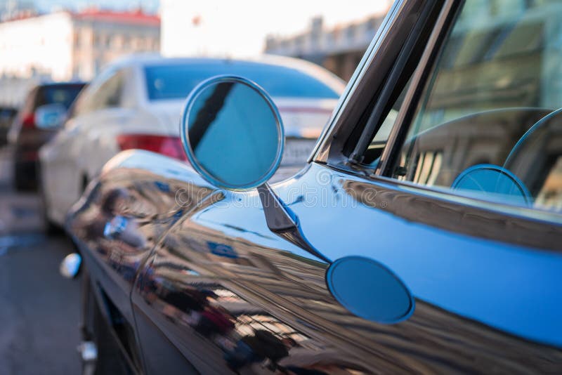 Retro car fragment. side mirror of a vintage car, vintage mirror of a car, round shape side mirror stock photo Retro car fragment. side mirror of a vintage car, vintage mirror of a car, round shape side mirror stock photo