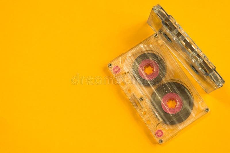 Retro Cassette Tape on the Yellow Background. Copy Space Stock Photo