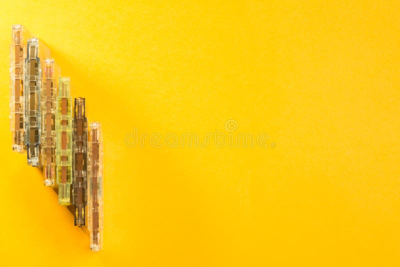Retro Cassette Tape on the Yellow Background. Copy Space Stock Photo