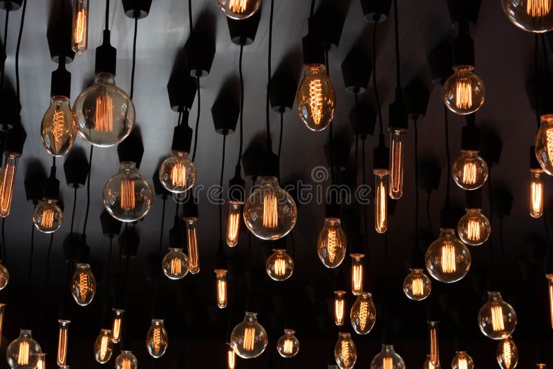 Retro Edison Lamp on a Black Background of the Ceiling. Concept Idea