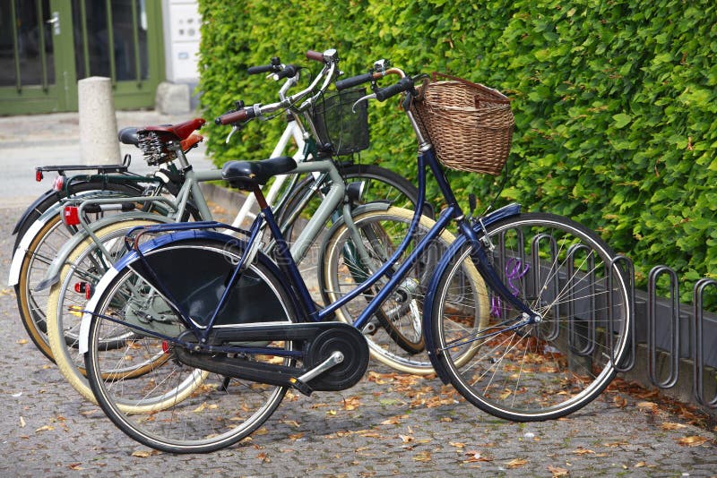 Retro parked bicycles / bikes with baskets. The eco way to travel. Retro parked bicycles / bikes with baskets. The eco way to travel.