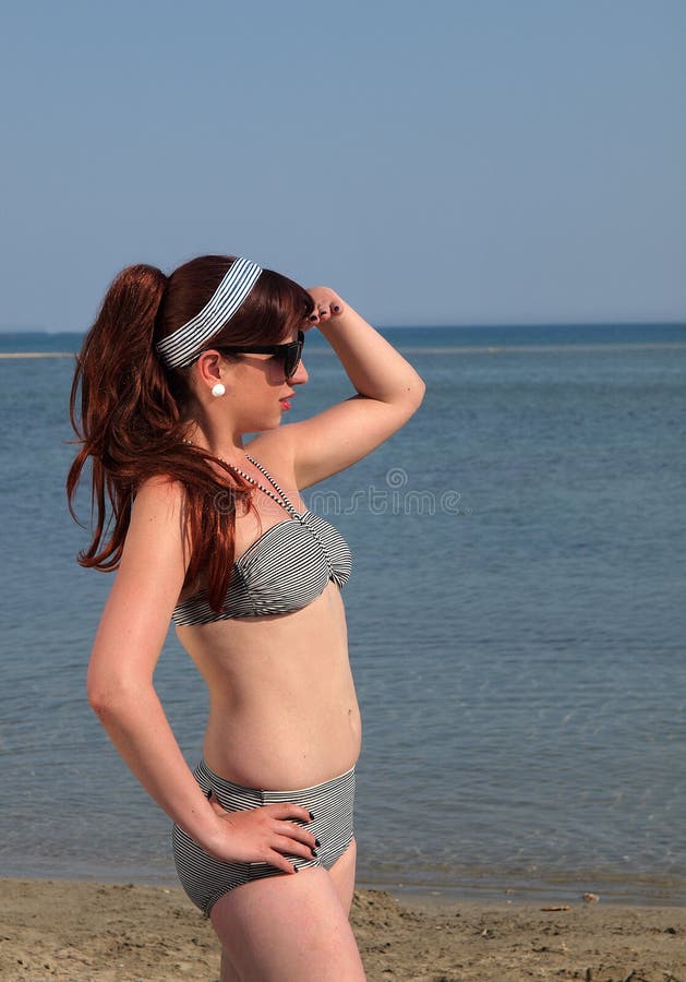 Retro girl at the beach