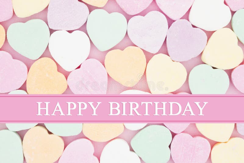 Retro Happy Birthday greeting, Retro heart shaped candy on pick fabric with text Happy Birthday. Retro Happy Birthday greeting, Retro heart shaped candy on pick fabric with text Happy Birthday