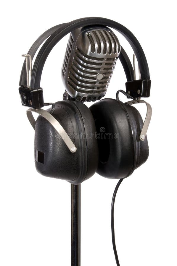 Retro microphone and vintage headphones isolated on white. Retro microphone and vintage headphones isolated on white