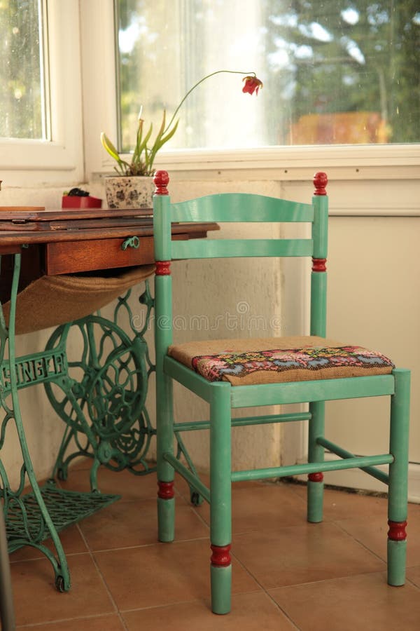 Retro Interior with Chair and Sewing Machine Table Repainted in Green