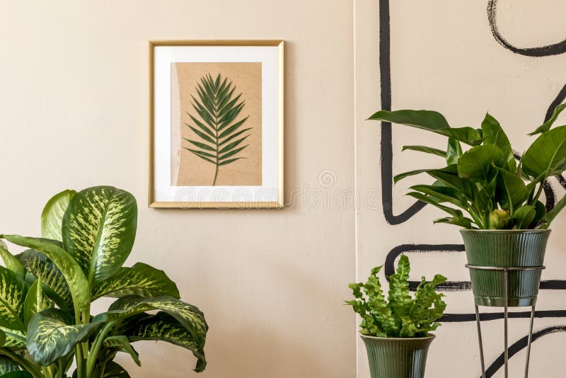 Retro space interior at home with gold mock up frame and potted plants.