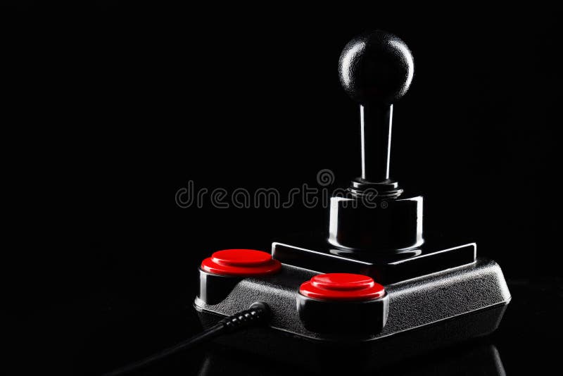 Retro joystick from 8-bit consoles. Game controller isolated on black background.