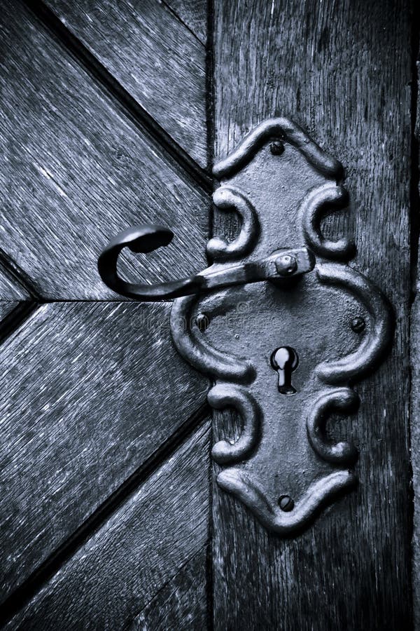 Retro keyhole in old wooden door