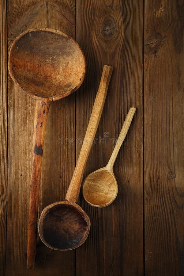 Retro kitchen utensils wood spoon on old wooden table in rustic