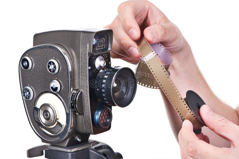 Retro Mechanical Movie Camera and Film in Hands Operator Stock Image