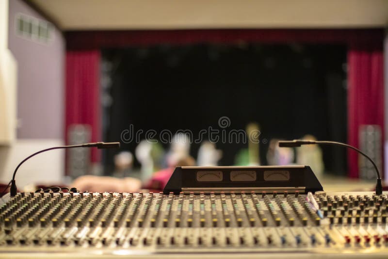 DJ Console in the Light of Spotlights and Neon Lights. Music and