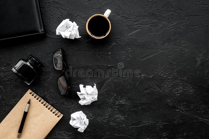 Retro and modern writer desktop with coffee, notebook and ink on black table background top view mock up royalty free stock photography Retro and modern writer desktop with coffee, notebook and ink on black table background top view mock up royalty free stock photography
