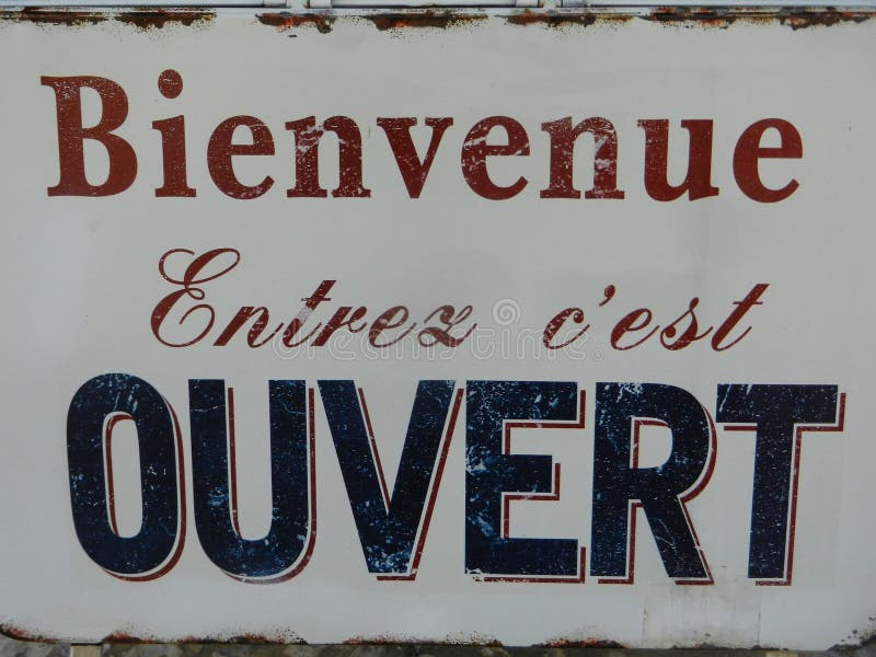 Sign at the entrance of a restaurant saying in French - Ouvert - meaning in  English - Open Stock Photo - Alamy