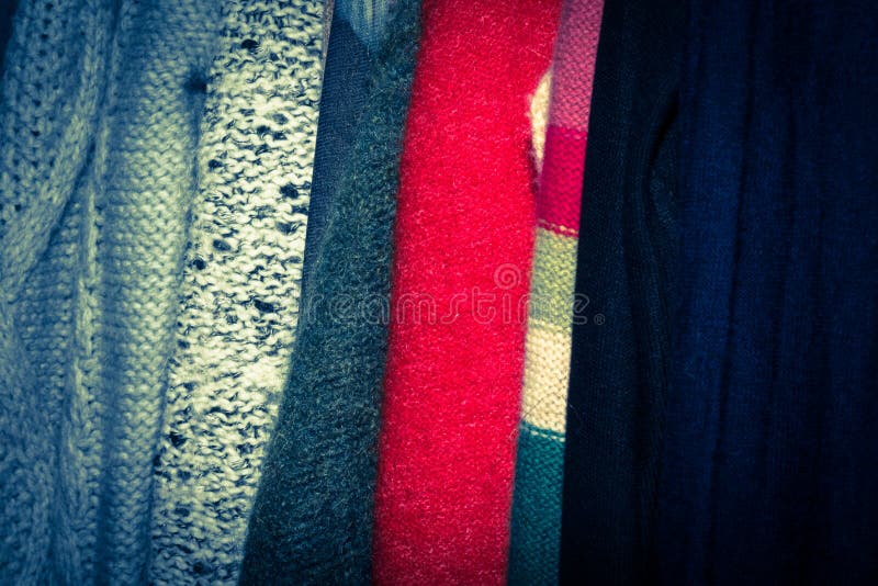Retro photo of dark silver, blue and red clothing items in a wardrobe stock photography Retro photo of dark silver, blue and red clothing items in a wardrobe stock photography