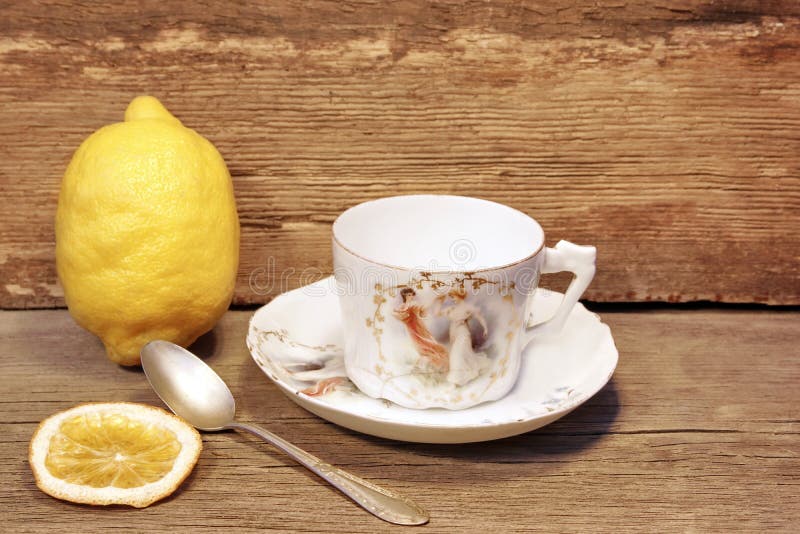 Retro Porcelain Tea Cup and Plate with Silver Spoon Stock Photo Image