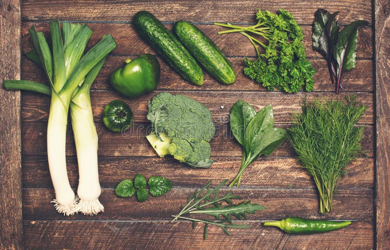 Retro styled food background. Raw detox green vegetable and herb royalty free stock images Retro styled food background. Raw detox green vegetable and herb royalty free stock images