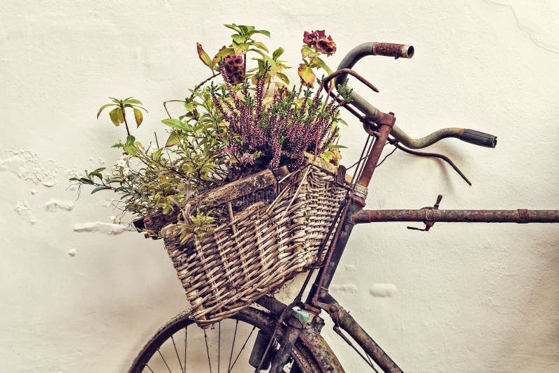 Retro styled image of an old bicycle with basket