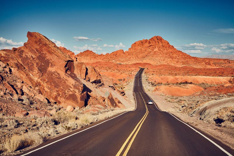 Retro stylized picture of a scenic desert road.