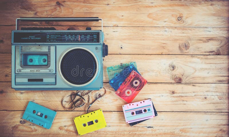 retro technology of radio cassette recorder music with retro tape cassette on wood table