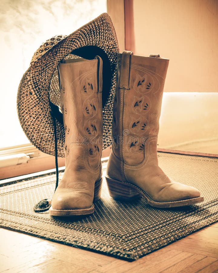 Retro toned Western Boots and Hat royalty free stock photography