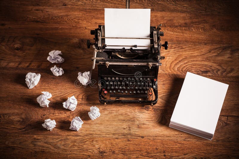 Retro typewriter on a wooden desk royalty free stock images