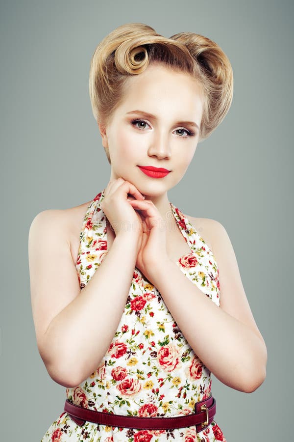 Retro vintage pin-up girl with elegant hairdo, portrait stock photo Retro vintage pin-up girl with elegant hairdo, portrait stock photo