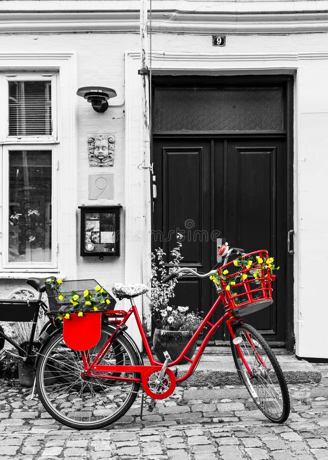 Retro vintage red bicycle on cobblestone street in the old town. royalty free stock photo Retro vintage red bicycle on cobblestone street in the old town. royalty free stock photo