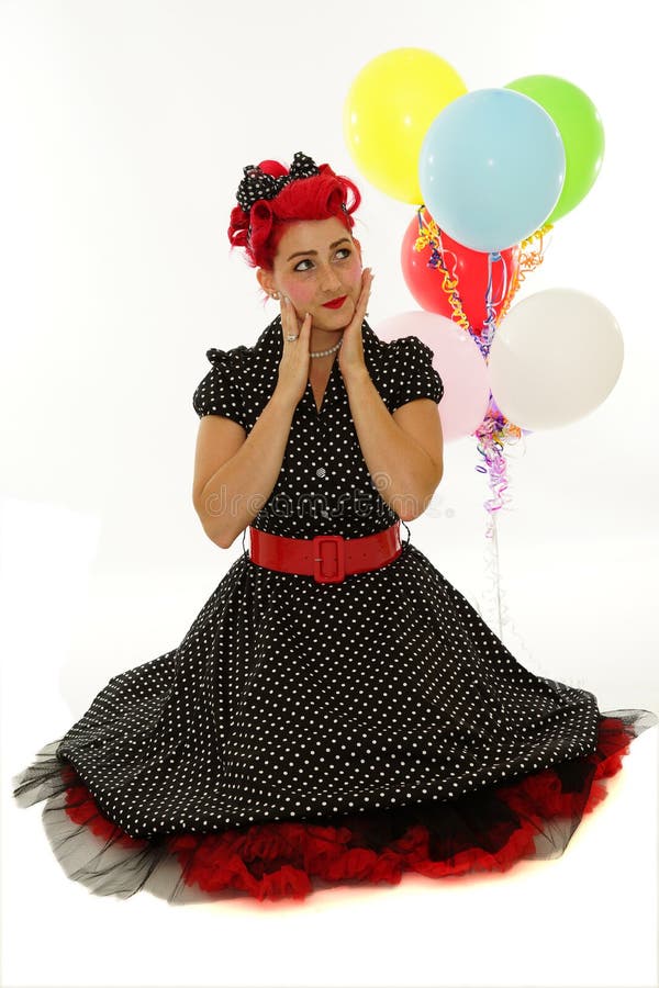 Retro vrouw met ballonnen stock foto