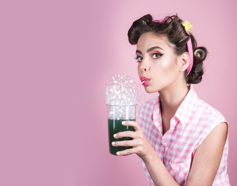 Retro woman drink summer cocktail. pinup girl with fashion hair. perfect housewife. pin up woman with trendy makeup