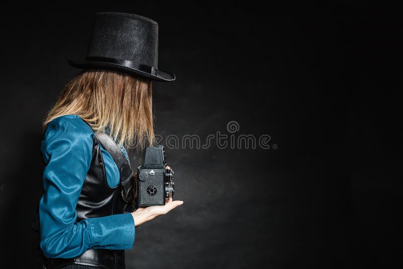 Retro woman with old camera. Steampunk. stock photo Retro woman with old camera. Steampunk. stock photo