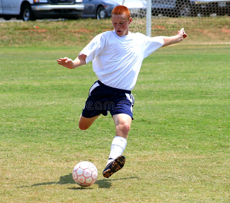 Soccer player preparing for a powerful kick. Soccer player preparing for a powerful kick.