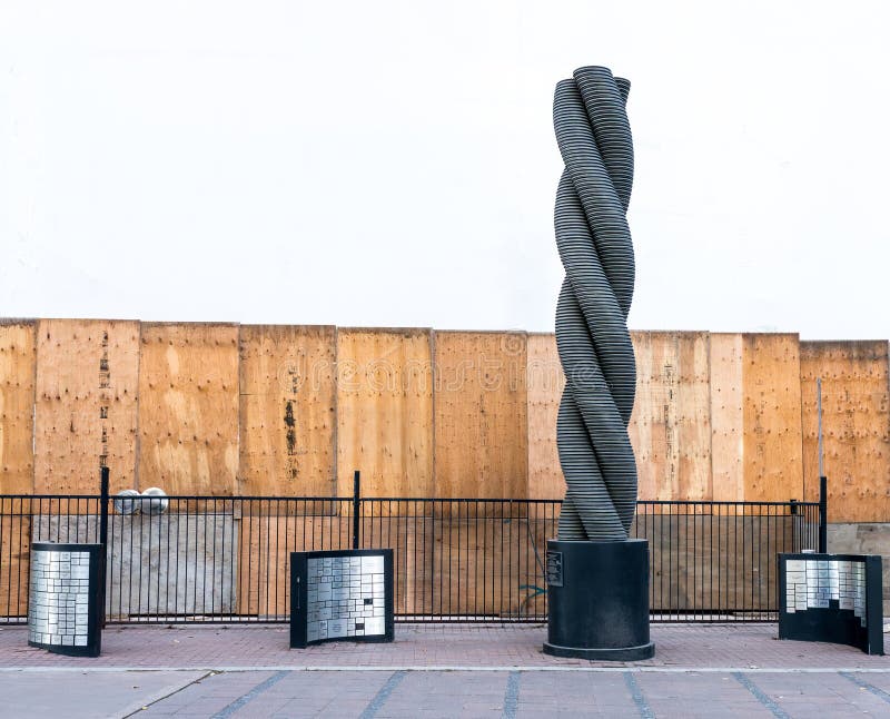 Edmonton, Canada, November 12: Return, 2001 20-ft high structure consisting of 390 individually cast, intertwining aluminum rings in 3 columns representing the Donors, the Foundation and its monetary Recipients by Catherine Burgess at 10053 Jasper Avenue.