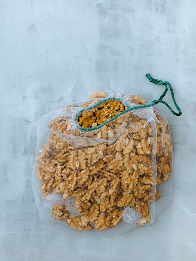 Mesh With Walnut And Hammer On A Wooden Background Stock Image Image