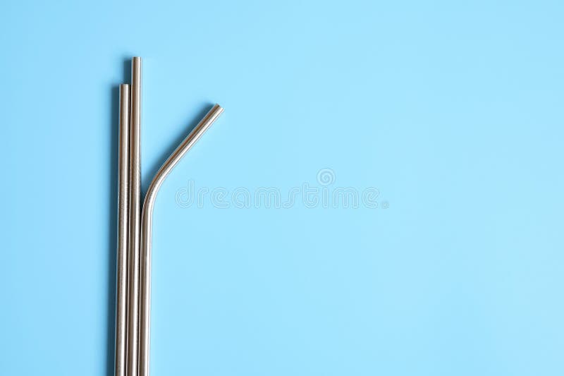 Download Reusable Metal Stainless Steel Drinking Straws On A Blue Background. Space For Text. Stock Photo ...