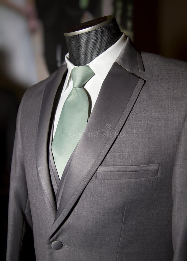 Grey mens dress coat jacket with vest and colorful tie. Grey mens dress coat jacket with vest and colorful tie.