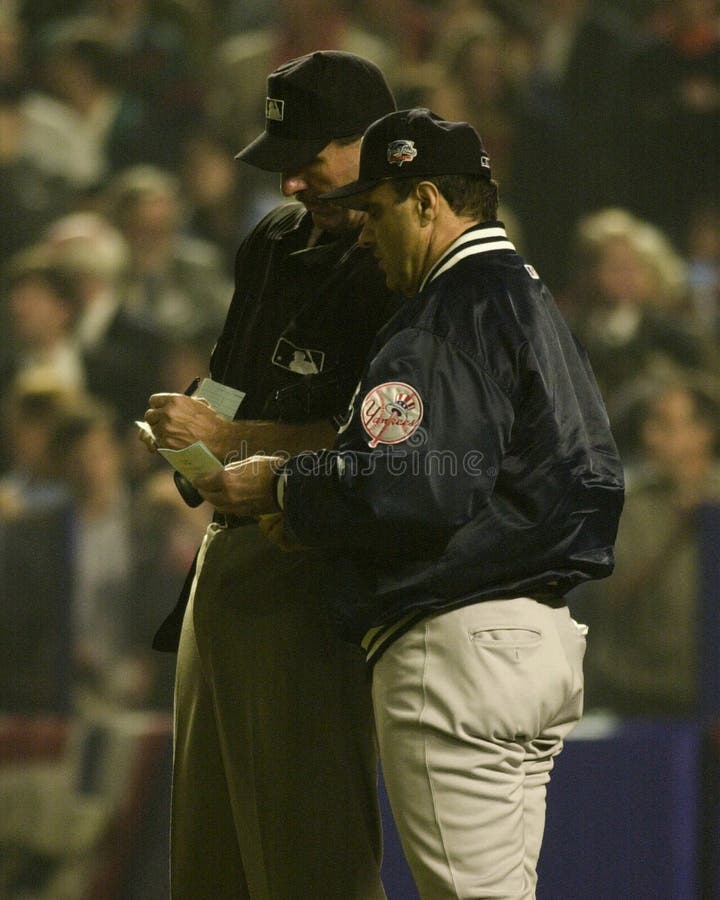 Yankees manager Joe Torre goes over the line up with home plate umpire Tim McClelland. (Image taken from color slide.). Yankees manager Joe Torre goes over the line up with home plate umpire Tim McClelland. (Image taken from color slide.)