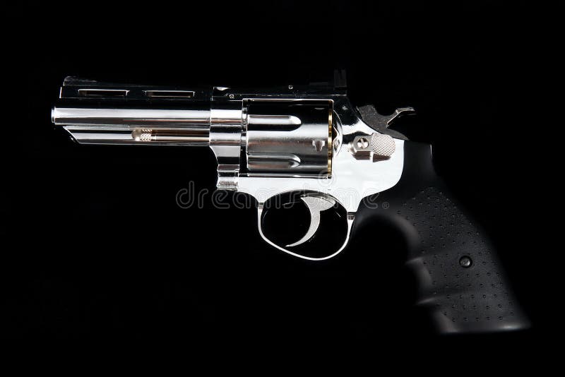 A Revolver Gun on a black background royalty free stock photos