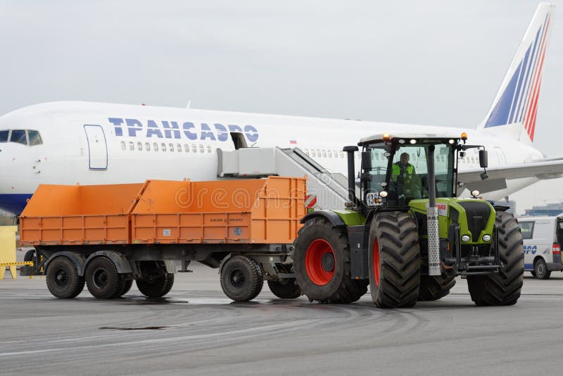 St. Petersburg, Russia - September 24, 2015: Tractor Xerion of Claas during the annual review of equipment in the Pulkovo airport. The review is held in order to prepare to winter. St. Petersburg, Russia - September 24, 2015: Tractor Xerion of Claas during the annual review of equipment in the Pulkovo airport. The review is held in order to prepare to winter