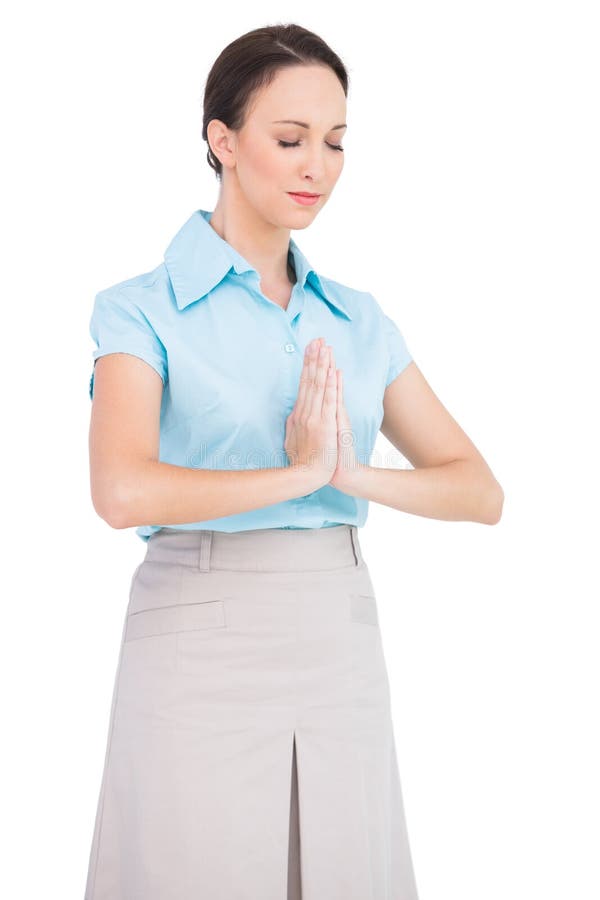 Rezar novo calmo da mulher de negócios foto de stock Rezar novo calmo da mulher de negócios foto de stock
