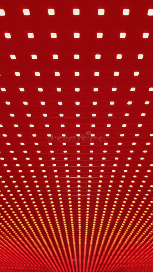 RGB LED screen panel texture. Close-up of a pixel LED screen with bokeh for wallpaper. Bright red abstract background perfect for