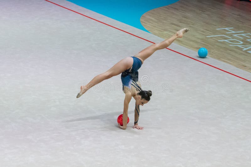 Rhythmic gymnastics editorial stock photo. Image of flexibility 264838368