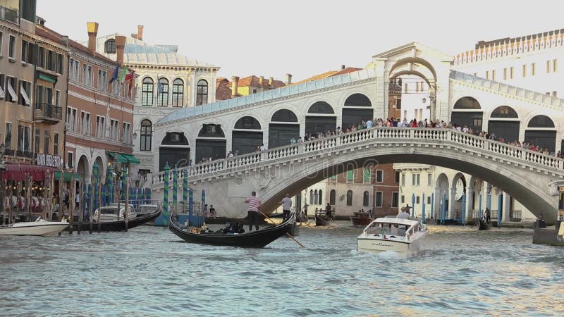 Rialto Bridge Bridge over the Grand Canal, Venezia, Italy. Venetian canal, many boats in the Grand Canal, boat under the stock video