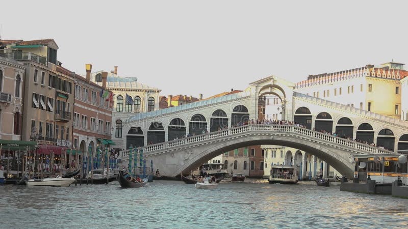 Rialto Bridge Bridge over the Grand Canal, Venezia, Italy. Venetian canal, many boats in the Grand Canal, boat under the stock video