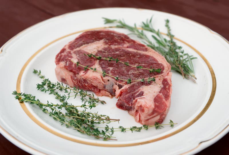 Rib Eye Steak on a Rustic Plate Stock Image Image of fresh