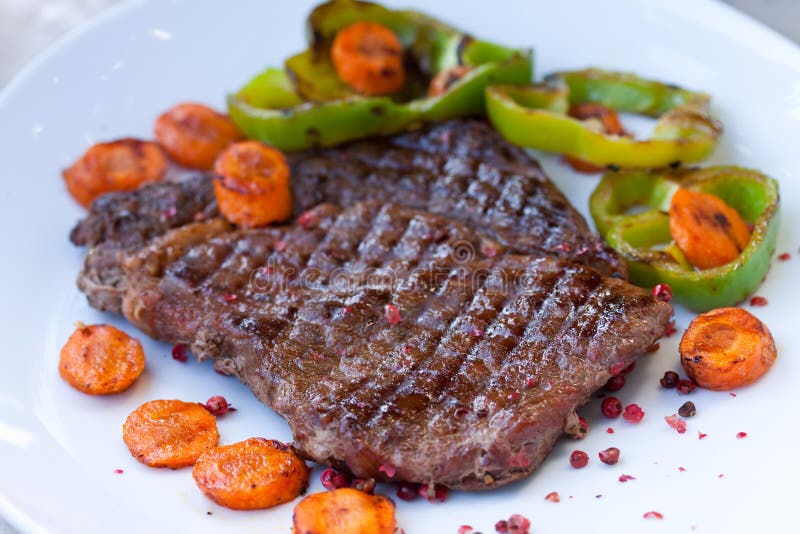 Rib Eye Steak on the White Plate Stock Photo Image of carrot