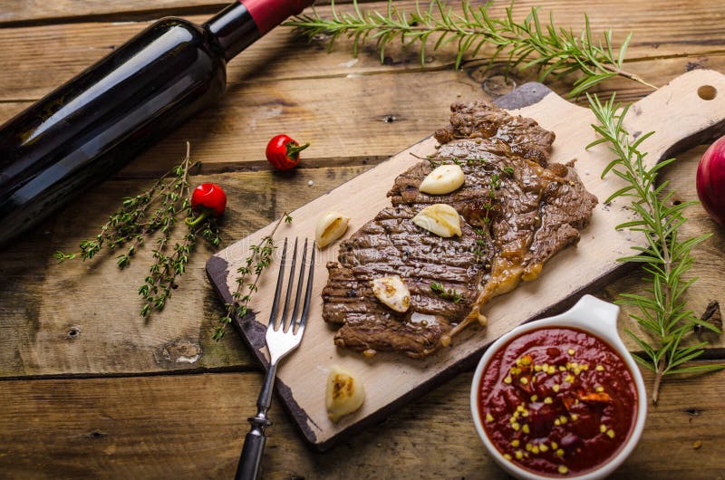 Rib eye steak with wine stock image. Image of herbs, piece 63515253
